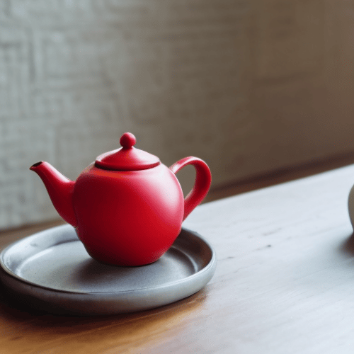 a small red container for tea